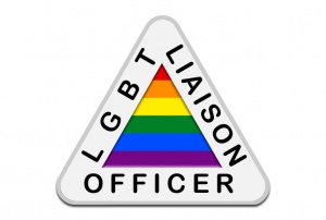 LGBT Liaison Officer surrounding a rainbow triangle