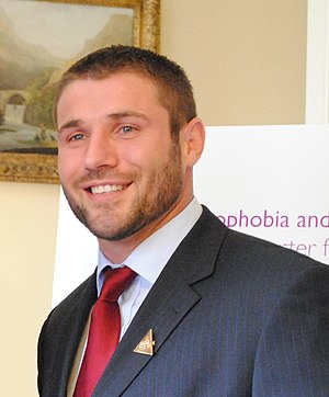 Ben Cohen in suit and tie with neatly-trimmed beard